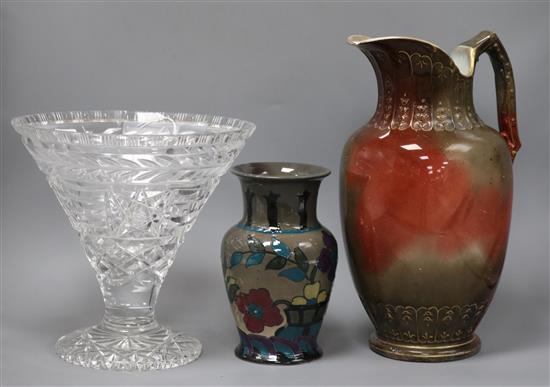 A large glass trumpet vase, a jug and a cut glass vase tallest 35cm